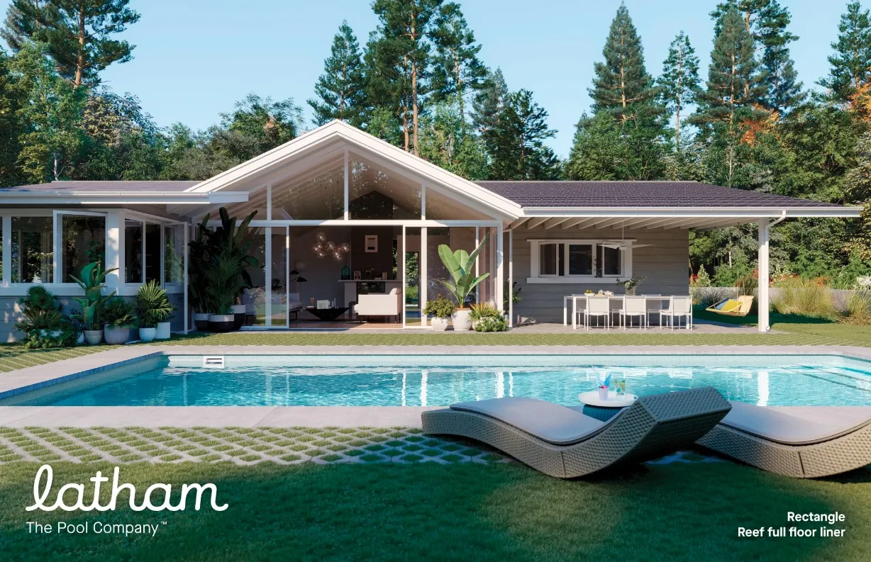 Latham manufacturer image of a rectangular swimming pool beside a modern home with patio lounge chairs
