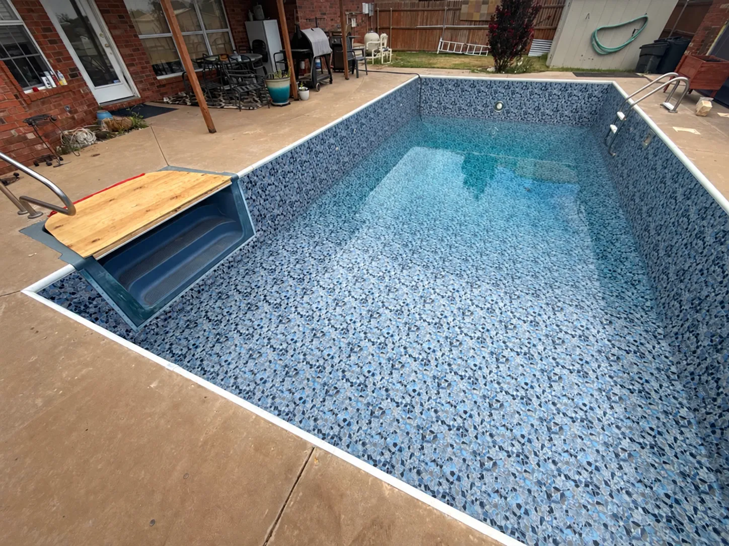 WTPP project photograph of a patterned vinyl liner in a partially filled pool