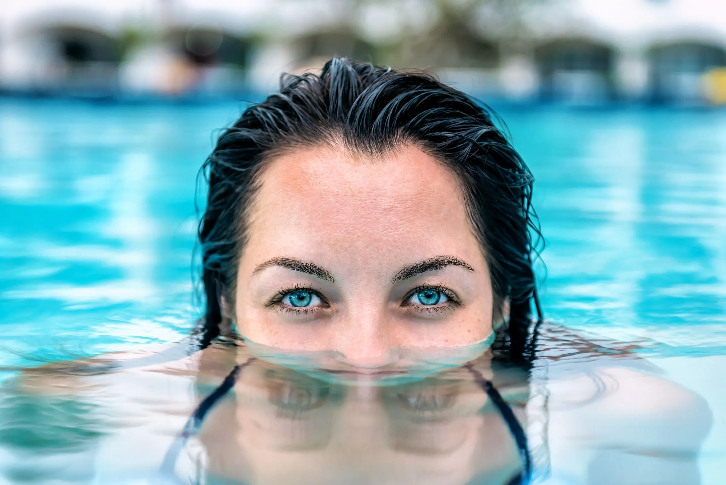 Swimmer in blue pool water, from Naked Pools manufacturer photography